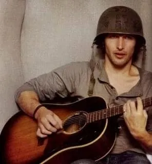 Bringing music to the front lines: James and his guitar serenade troops and locals in war-torn regions.