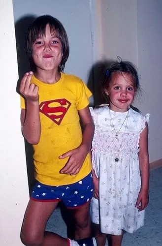 Angelina Jolie as a kid, together with her sister.