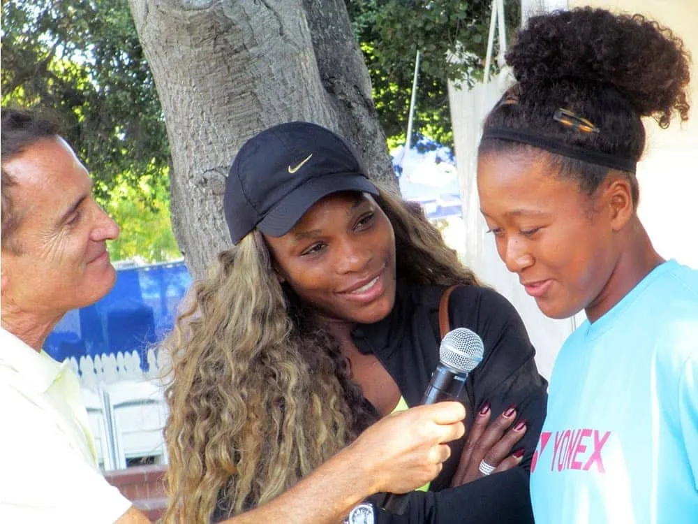 Naomi Osaka being interviewed at the 2014 Stanford Classic alongside Serena Williams.