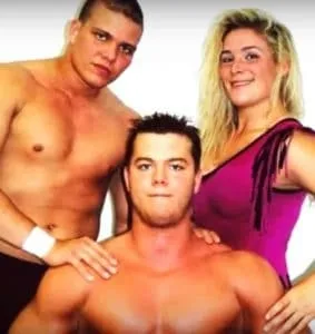 Natalya Neidhart made her debut as a member of the Next Generation Hart Foundation alongside her cousins Teddy Hart and Harry Smith (standing left).