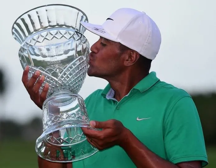 Tony Finau is celebrating with the Puerto Rico Open trophy in 2016.