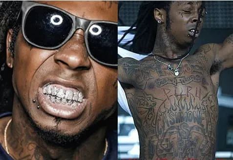 Lil Wayne showing off his diamond teeth and numerous tattoos.