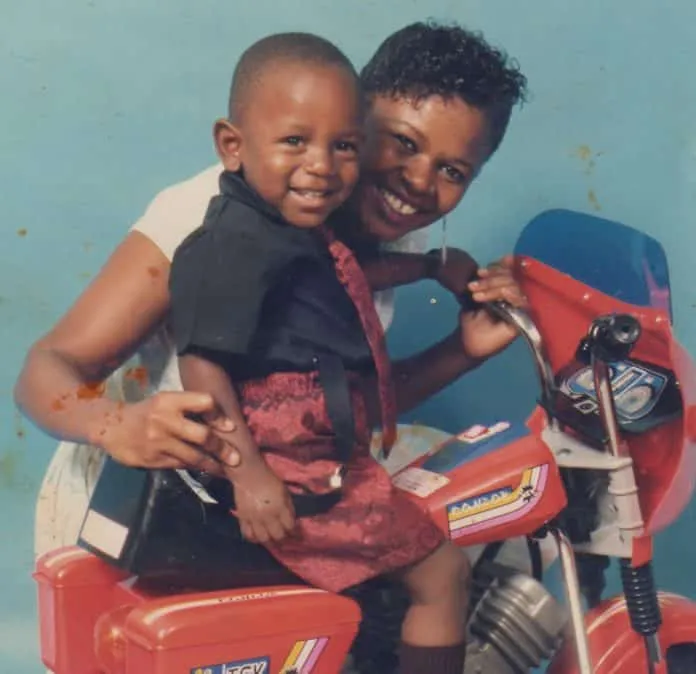 This is Kendrick Lamar in his childhood, alongside Paula Oliver, his Mother. Rising Above Adversity: Kendrick Lamar's Journey from Compton to Becoming a Proud American of Afro-American Descent.