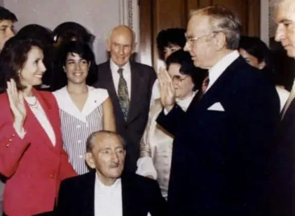 It was an emotional moment for her wheel-bound dad as she took the oath of office in 1987. Credit: BusinessInsider.
