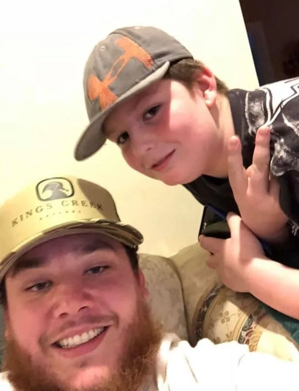 Luke combs pictured alongside his cousin, Clayton. They both look cool together.