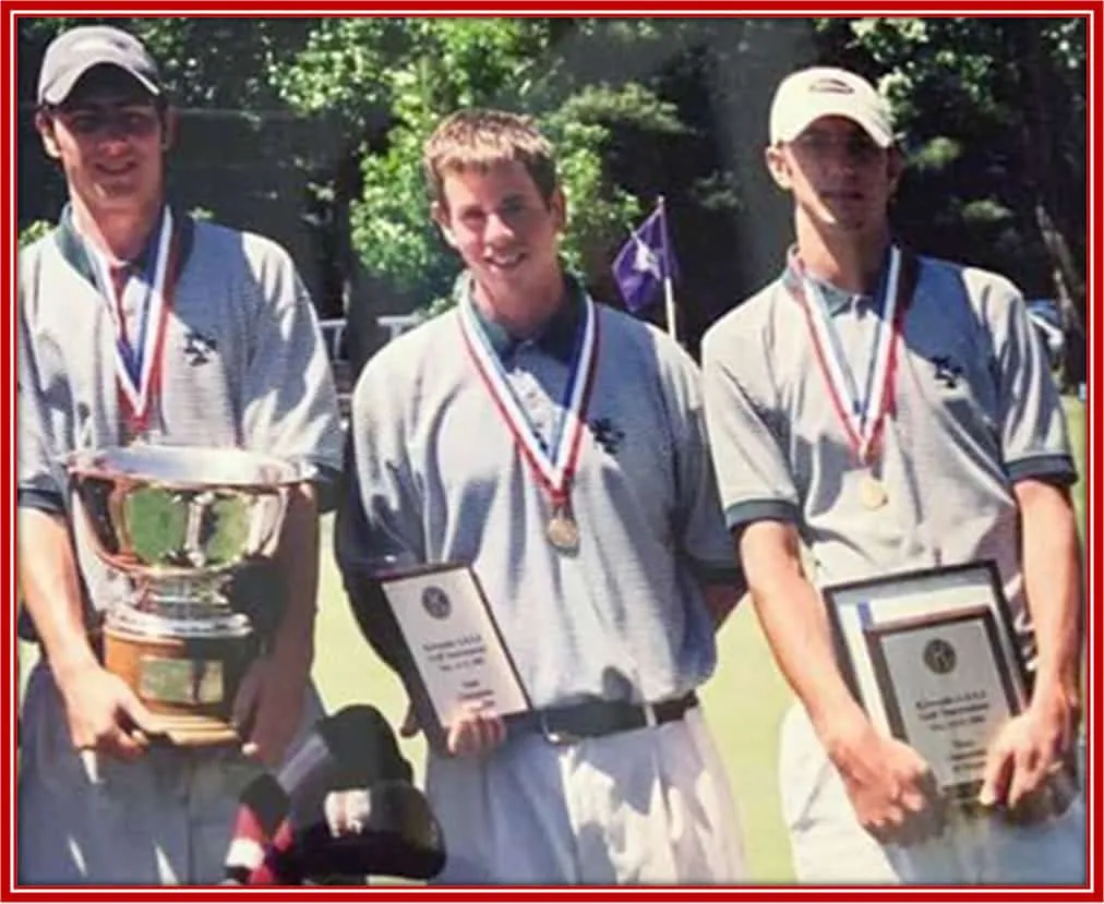 Dustin (far right) - A photo with high schoolmates showcasing their team awards.