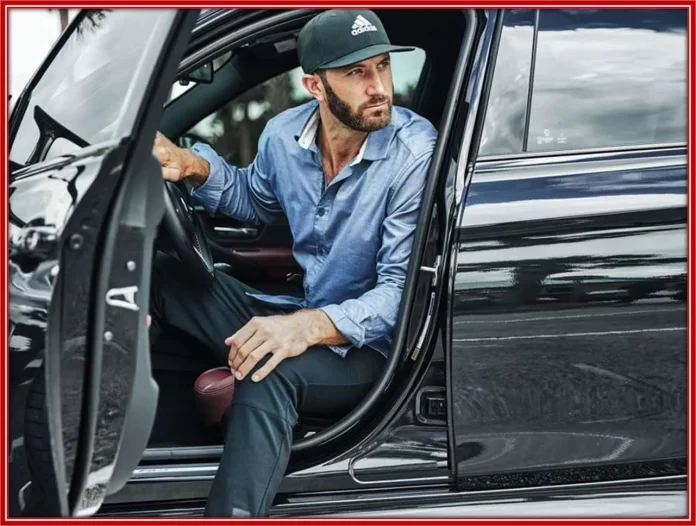 The top-ranking golfer with one of his luxury car.