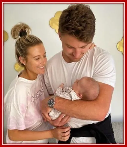 Billie Rose Barrett in the loving arms of her parents.