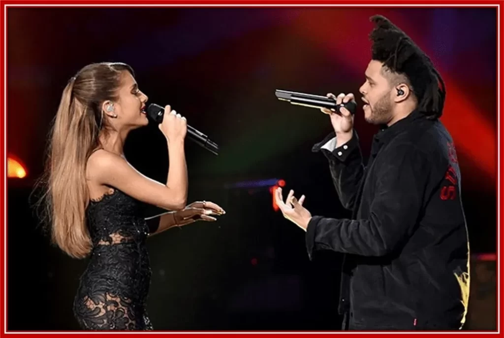The Weeknd in a partnership performance with Ariana Grande in 2014.