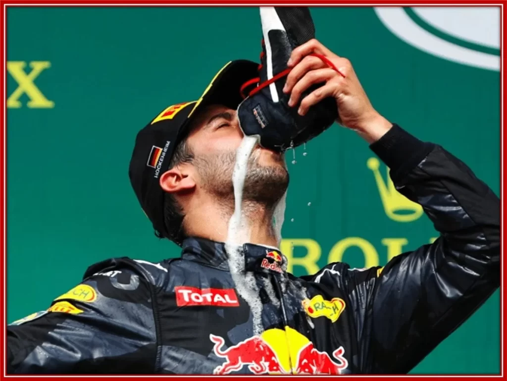 The Aussie F1 driver celebrates his podiums by drinking champagne from a shoe.
