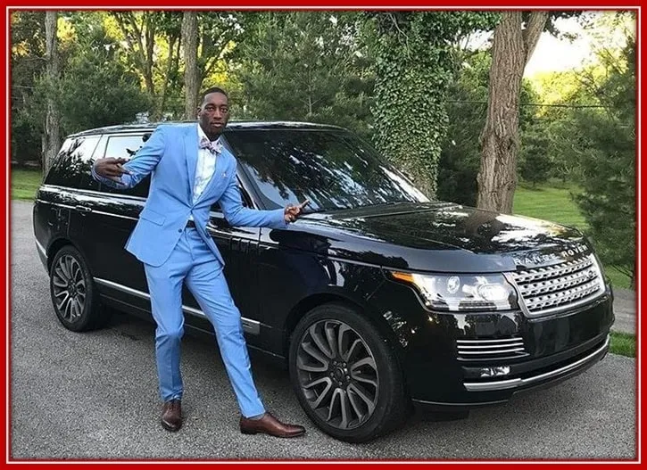 The American Miami Player Posing With His Range Rover Sports Clad in an Impeccable Pair of Suit.