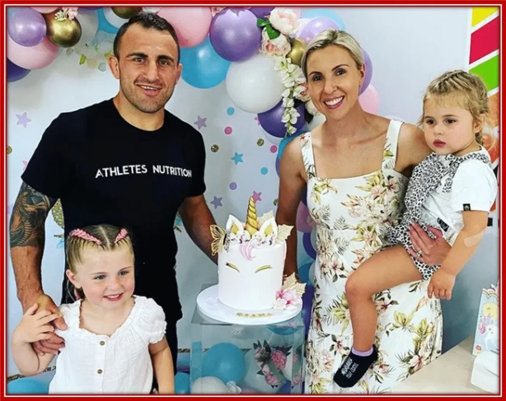 The UFC Champ with his alluring wife and two kids.