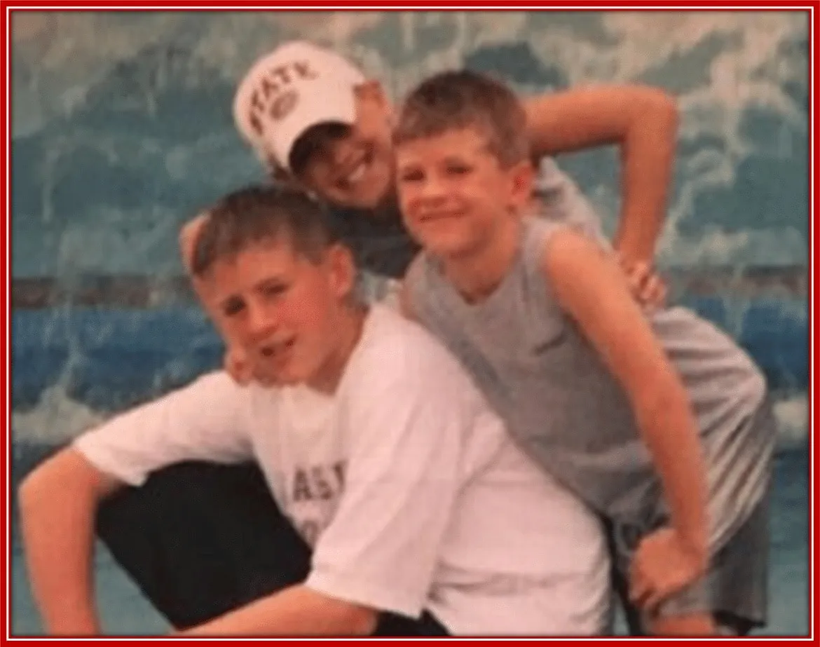J.J., Derek (middle) and T.J. pose at Sea World for a yearly family cruise.
