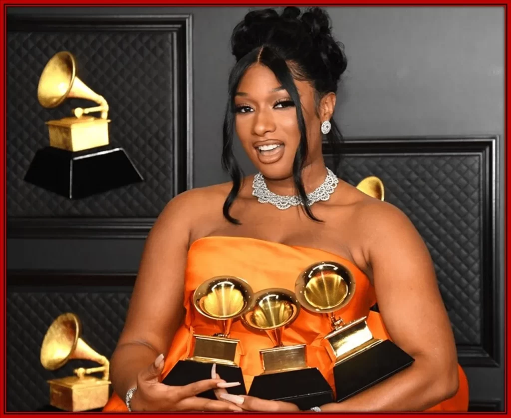 Megan Thee Stallion poses with her grammys during the 63rd Annual GRAMMY Awards at LA.