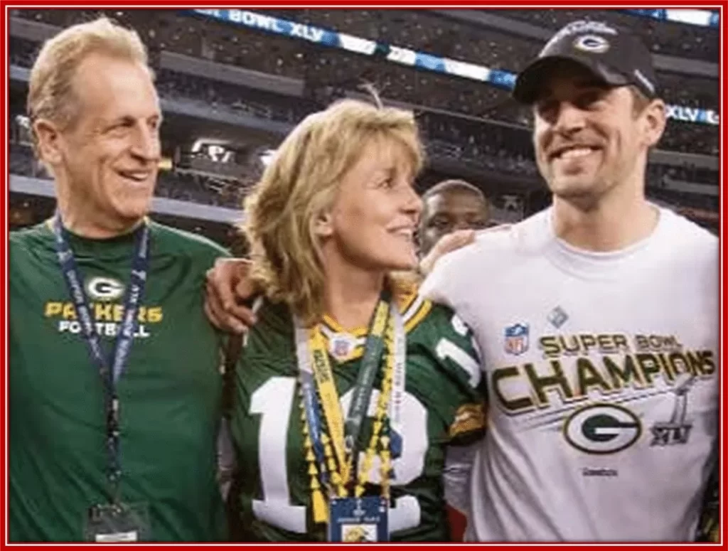 A photo of Aaron's mum, Darla with her husband, Ed, and Aaron Rodgers himself.
