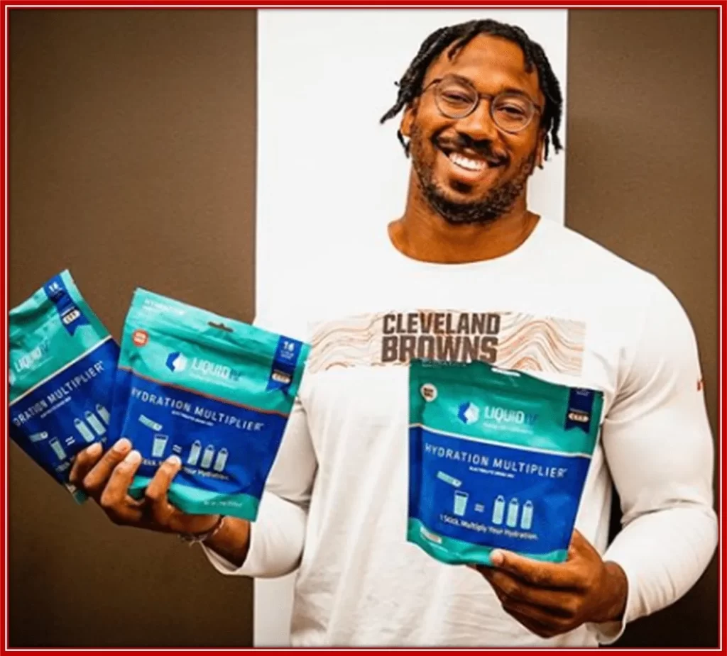 Photo of Myles with one of his endorsement products.
