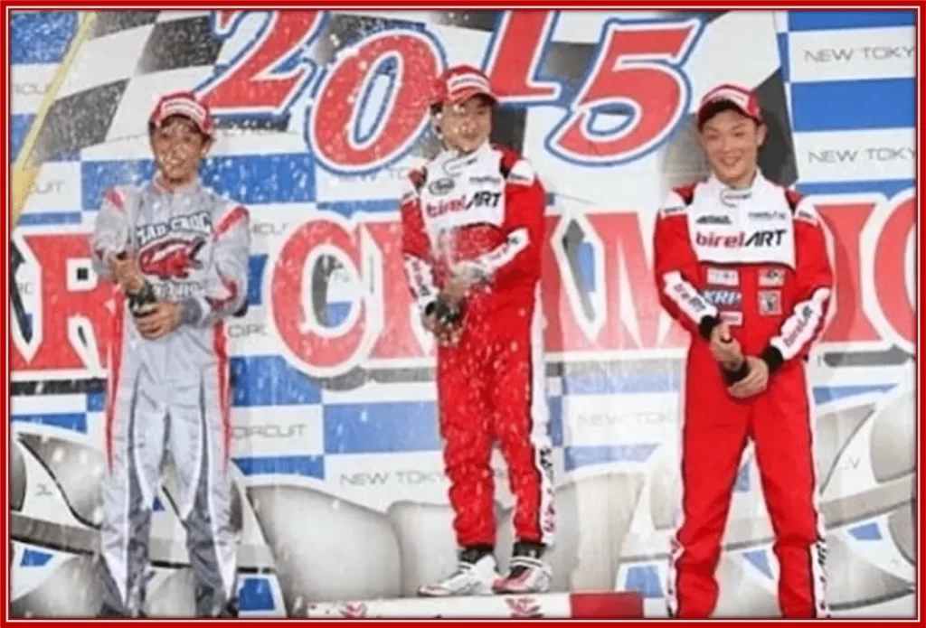 Yuki Tsunoda (middle), celebrating one of his first wins during his karting days.