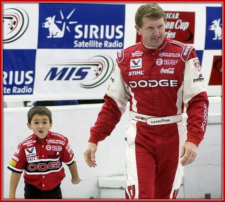 The little Chase Walking Happily Beside his Father, Bill Elliott.
