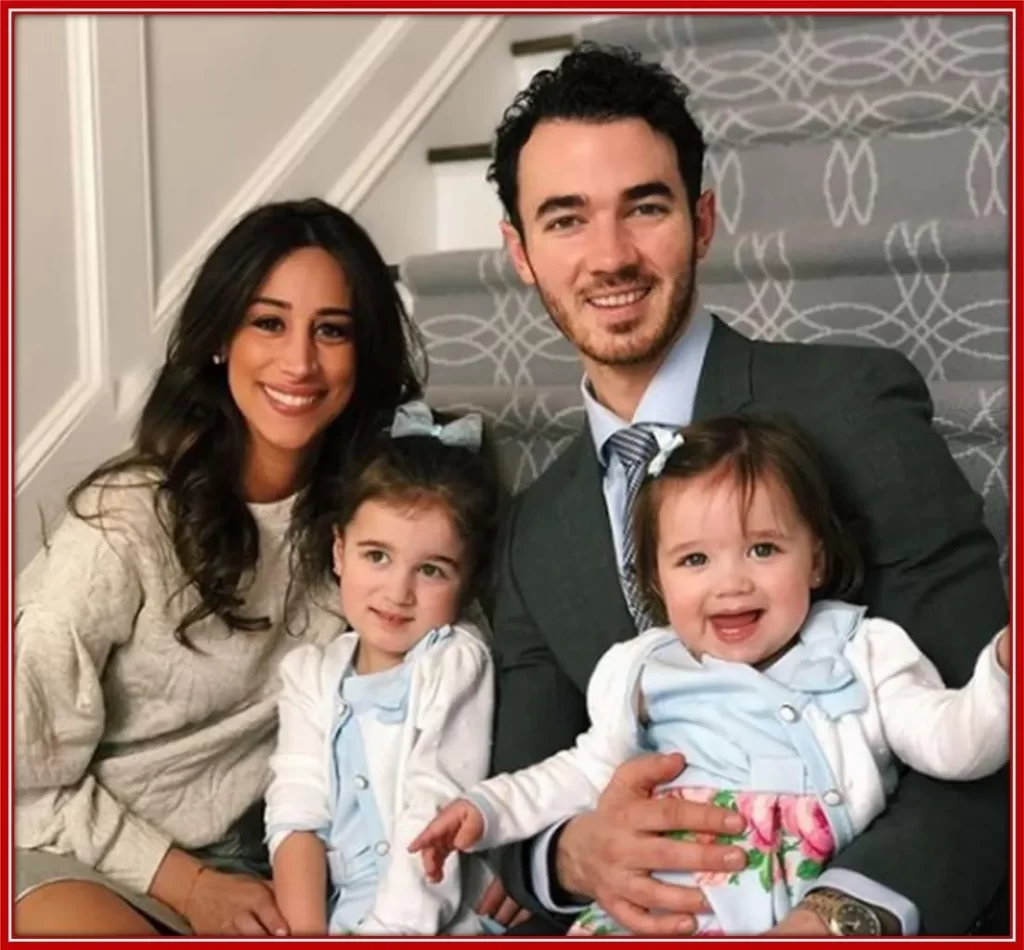 A photo of Paul Kevin with his wife, Danielle Deleasa, and their two daughters.
