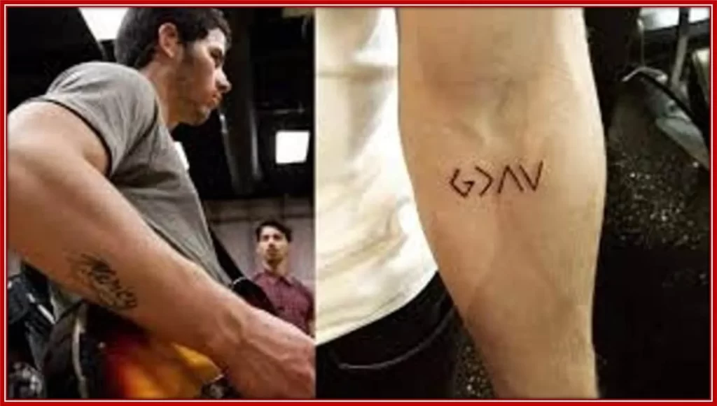 The tattoo symbolizes the Nicks’ religious beliefs - it means God is greater than the highs and lows.