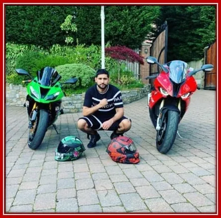 The Biker Amir Khan With his Green and Red Bike.