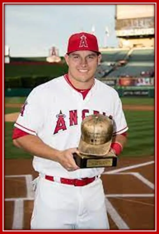 Mike Trout Posing With the Most League Player Awards in 2016.