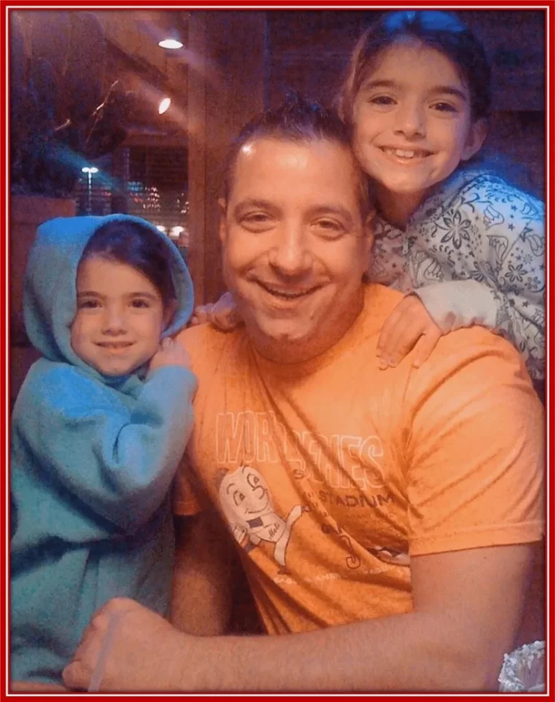 An early photo of Marc D'Amelio with his two daughters.