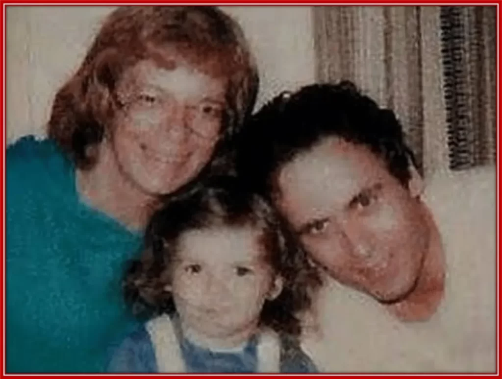 A cheerful photo of Ted Bundy with his wife, Carole Ann Boone and their daughter, Rose.