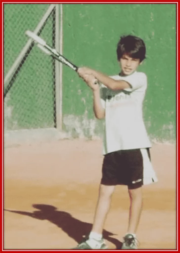 An early picture of Carlos Alcaraz playing tennis.