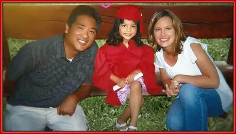 Behold the Young Graduate, Olivia, With her Father and Mother by her Side.