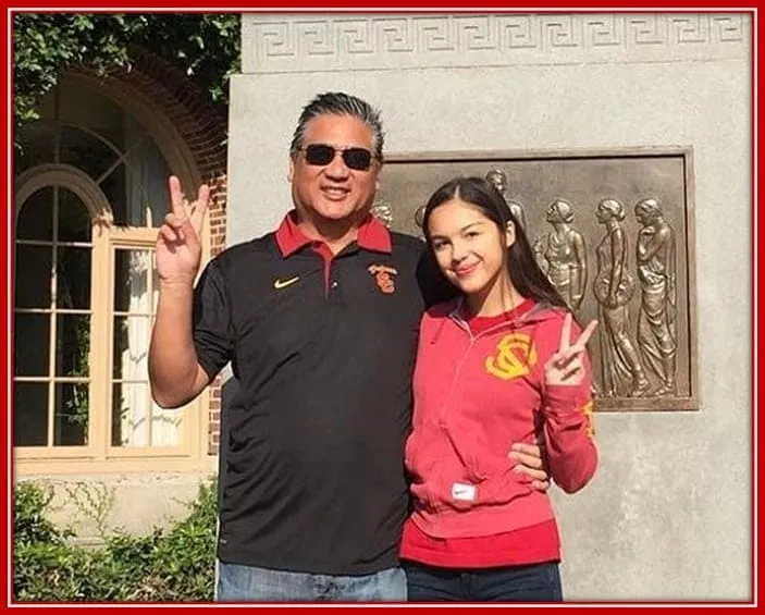 Meet Ronald Rodrigo With Olivia as They Share a Peace Sign in the Photo.
