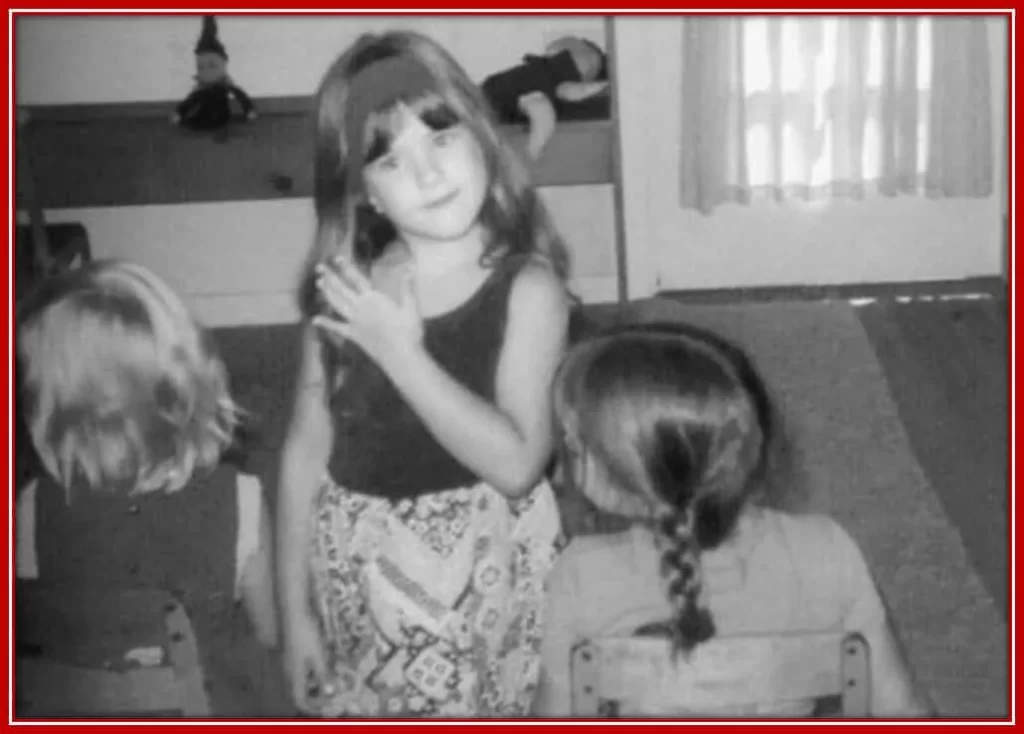 The Young Child Jennifer Showcasing her Dress to her Little Friends.